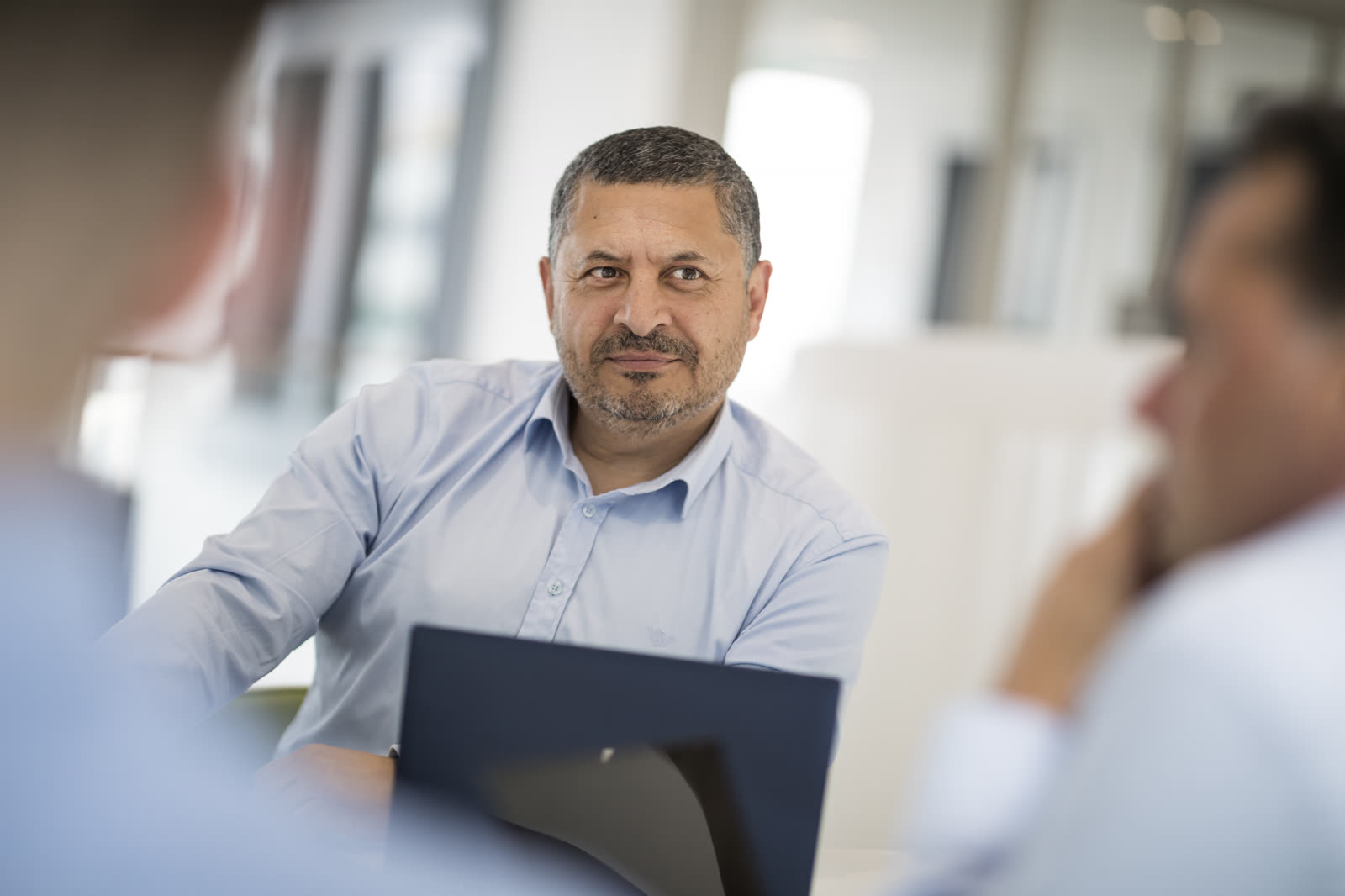A We Can consultant during a client conversation